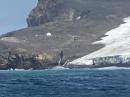 Bouvet Island, site of the 3Y0J DXpedition. The operating location is shown in the center-left of the image, among the rocks. [3Y0J Bouvet Island 2023 DXpedition, photo]